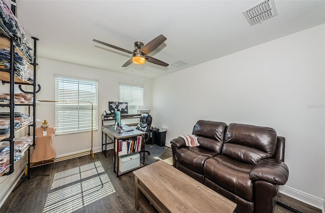 office space featuring ceiling fan and dark hardwood / wood-style floors