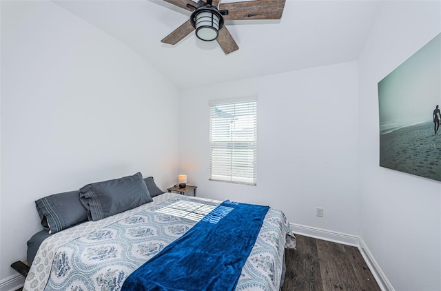 bedroom featuring lofted ceiling, dark hardwood / wood-style floors, and ceiling fan