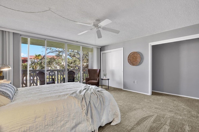 carpeted bedroom with a closet, ceiling fan, a textured ceiling, and access to exterior