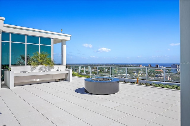 wooden terrace with a fire pit