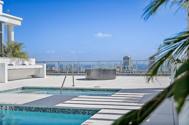 view of swimming pool with a patio area