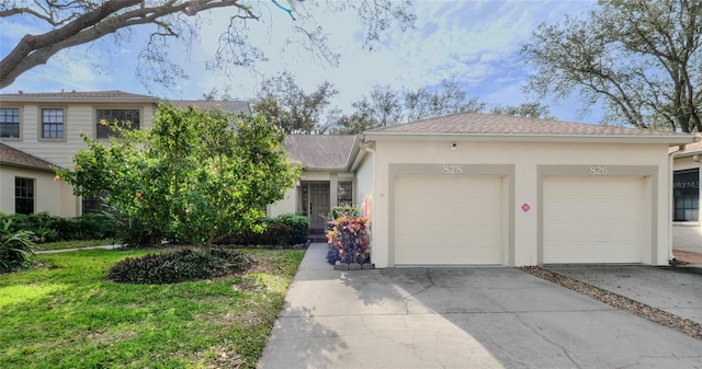 view of front of home with a garage and a front yard