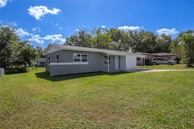 ranch-style home with a front lawn