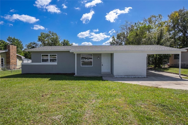 ranch-style home with a carport and a front lawn