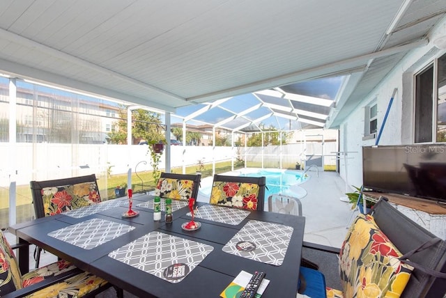 view of patio with a fenced in pool and glass enclosure