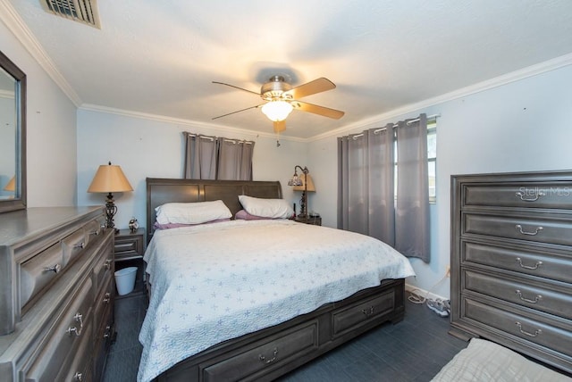 bedroom with ornamental molding and ceiling fan