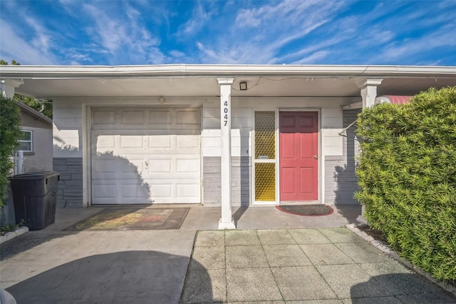 entrance to property featuring a garage