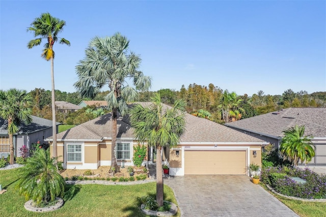 view of front of house with a front lawn and a garage