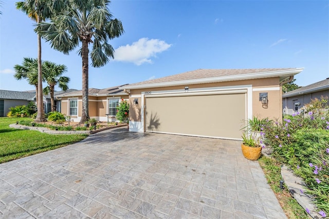 single story home featuring a garage