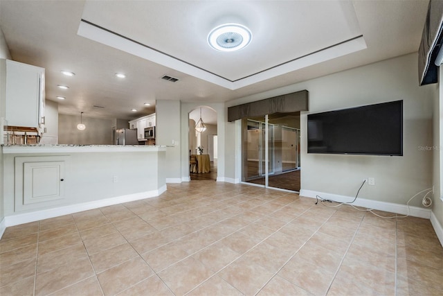 unfurnished living room with light tile patterned floors