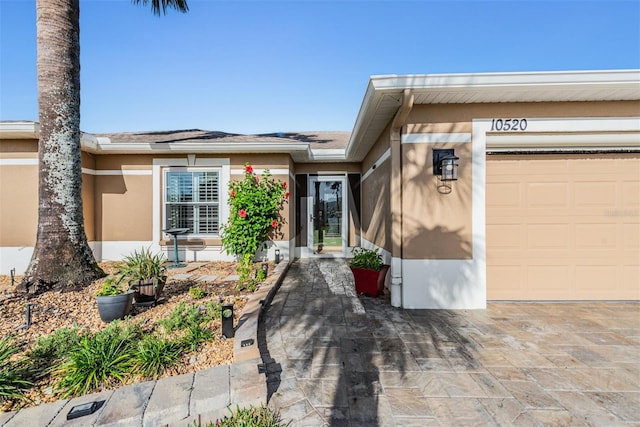 entrance to property featuring a garage