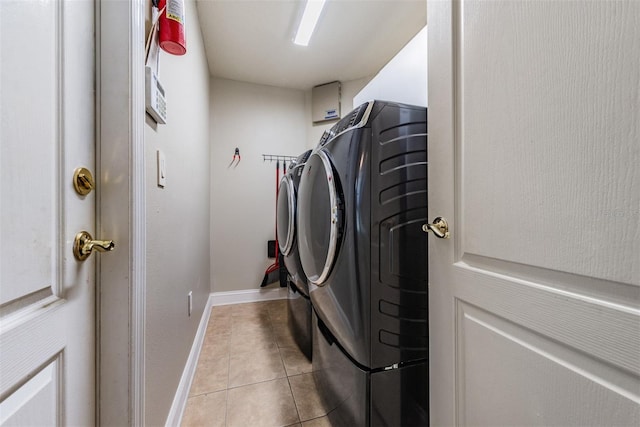 washroom featuring light tile patterned flooring and separate washer and dryer