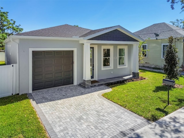 ranch-style home with a garage and a front yard