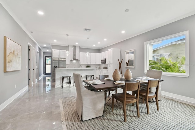 dining area with crown molding