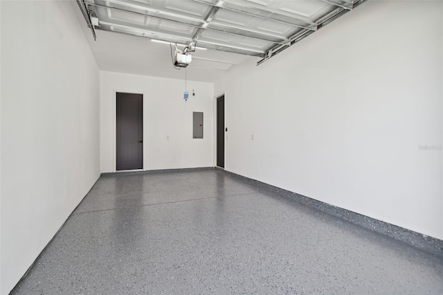 garage featuring electric panel and a garage door opener