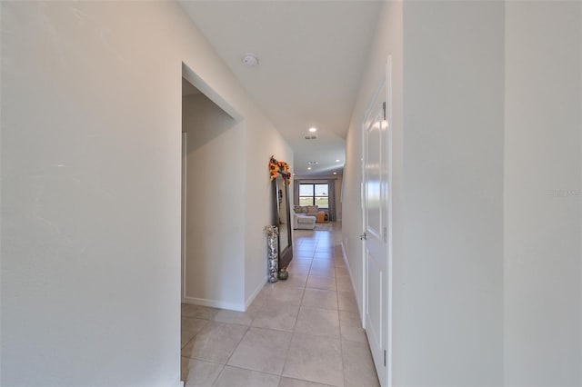 hallway featuring light tile patterned floors