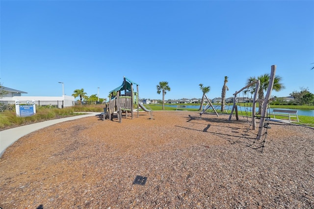 view of play area with a water view