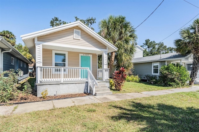 bungalow-style house featuring a front yard and a porch