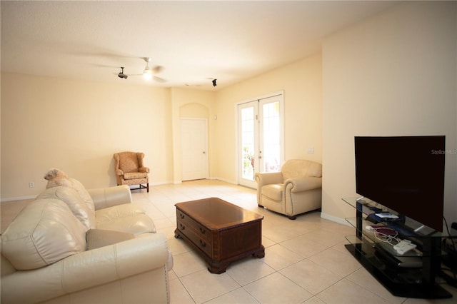 tiled living room featuring french doors