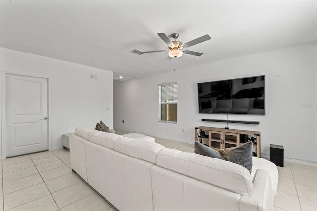 living room featuring ceiling fan and light tile patterned floors