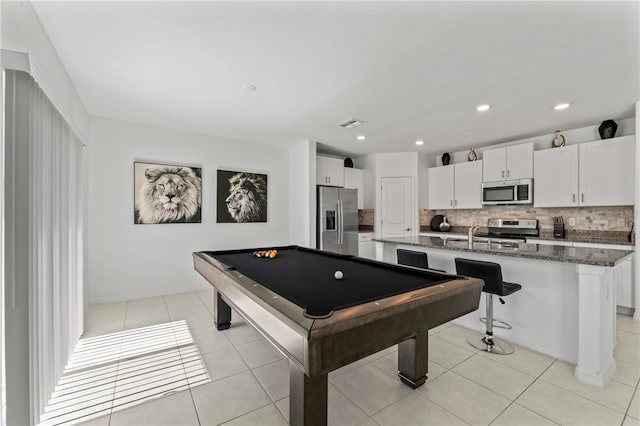 playroom with light tile patterned floors and billiards