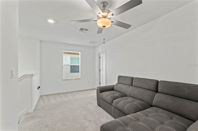 living room featuring ceiling fan and light colored carpet