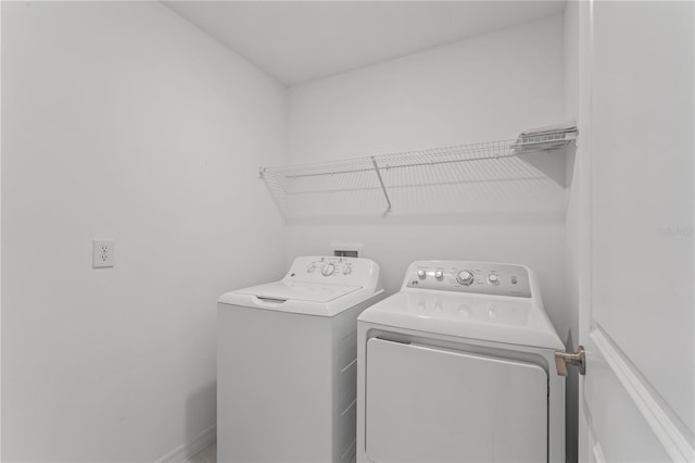 laundry room featuring washer and clothes dryer