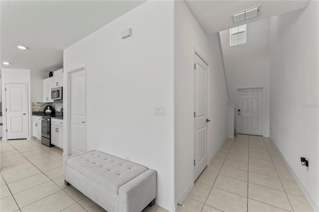 hallway with light tile patterned flooring