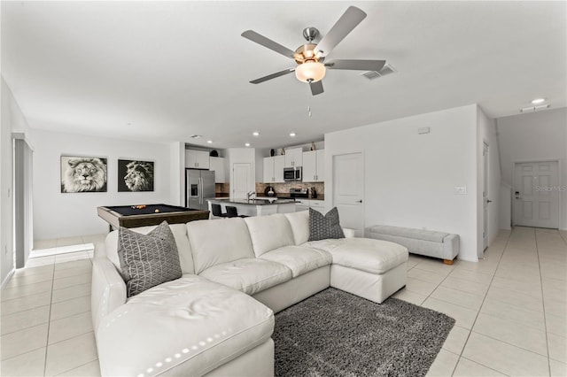 tiled living room featuring ceiling fan and billiards