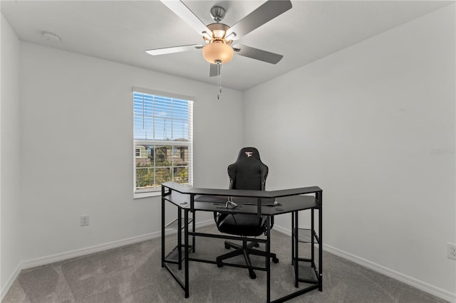 home office with carpet flooring and ceiling fan