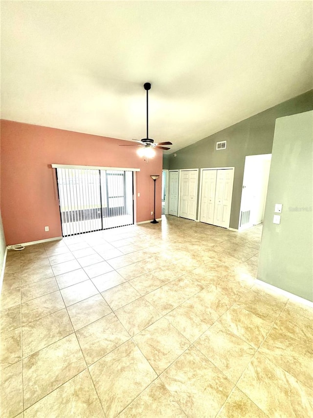 spare room featuring ceiling fan and vaulted ceiling