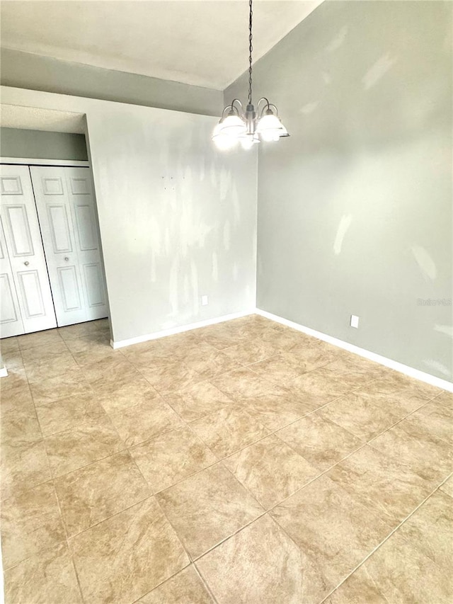 unfurnished dining area featuring an inviting chandelier