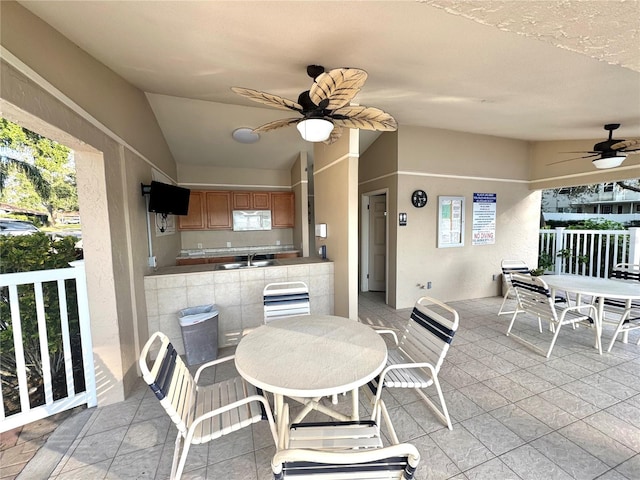 view of patio / terrace with sink, an outdoor kitchen, and ceiling fan