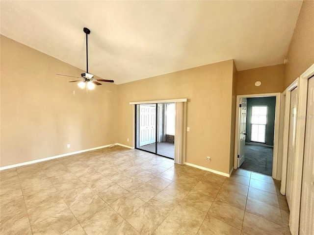 spare room featuring lofted ceiling and ceiling fan