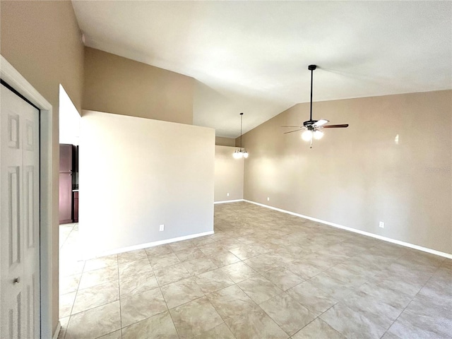 spare room featuring lofted ceiling and ceiling fan