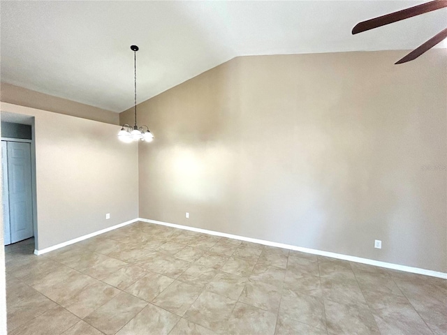 empty room featuring lofted ceiling and ceiling fan with notable chandelier