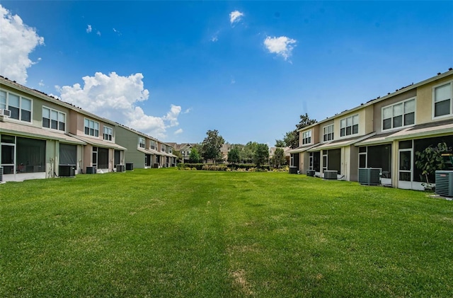 view of yard with central AC unit