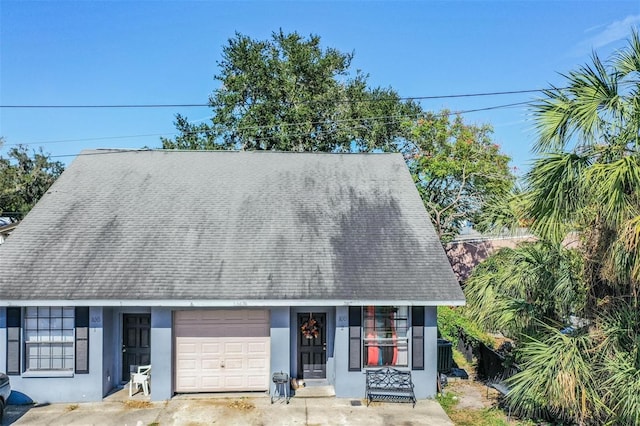 view of front of home featuring a garage and a porch