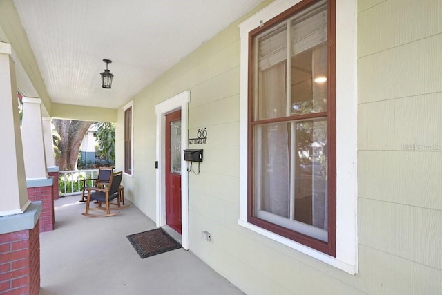 entrance to property featuring a porch