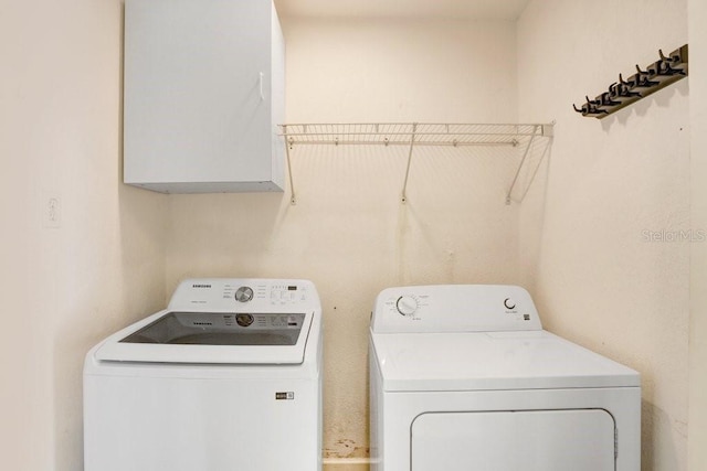 laundry area with washer and dryer