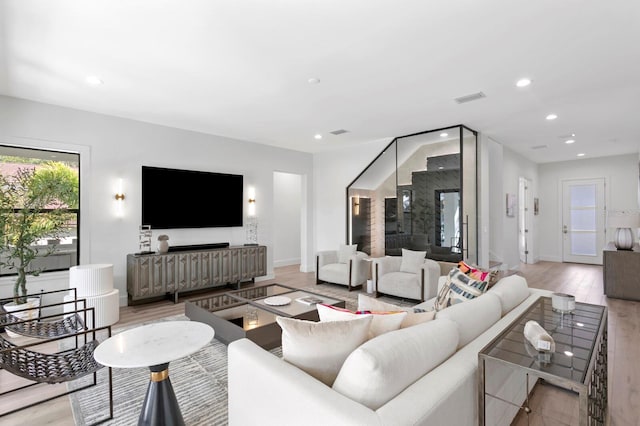 living room with light hardwood / wood-style flooring