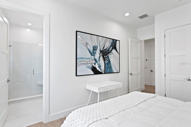 bedroom with light hardwood / wood-style floors