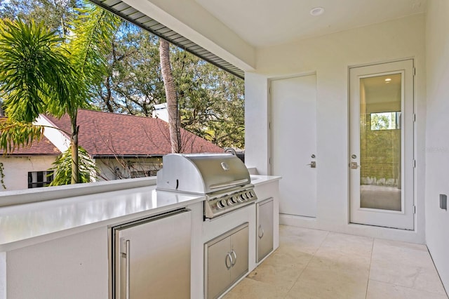 view of patio with exterior kitchen and grilling area