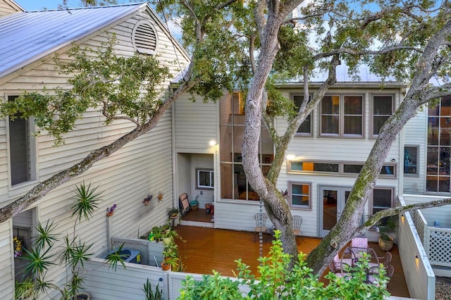 back of house featuring a deck