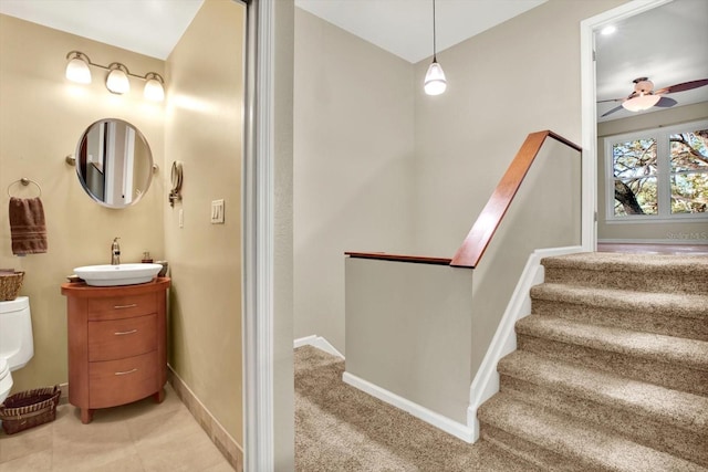 bathroom with vanity, toilet, and ceiling fan