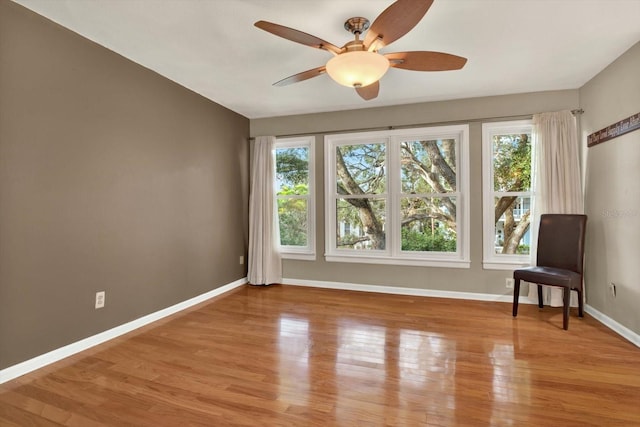 unfurnished room with ceiling fan and light hardwood / wood-style flooring