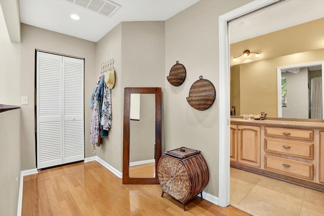 corridor featuring light hardwood / wood-style flooring