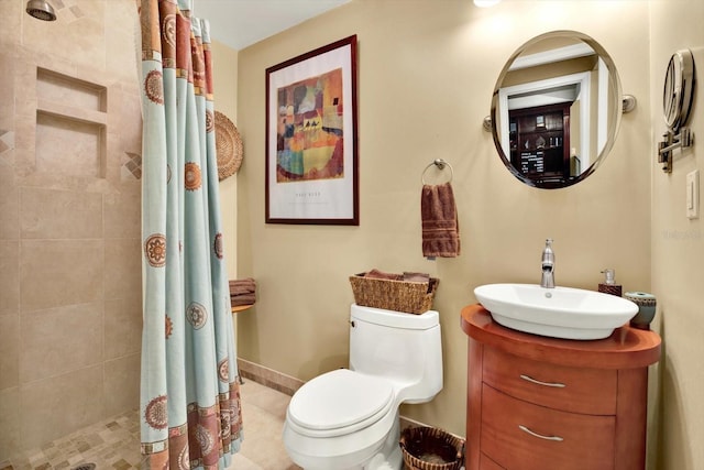 bathroom with vanity, a shower with shower curtain, toilet, and tile patterned flooring