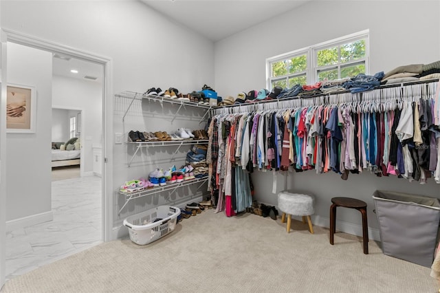 4586 Hickory Oak Dr, Brooksville, FL 34601 - walk in closet featuring marble finish floors