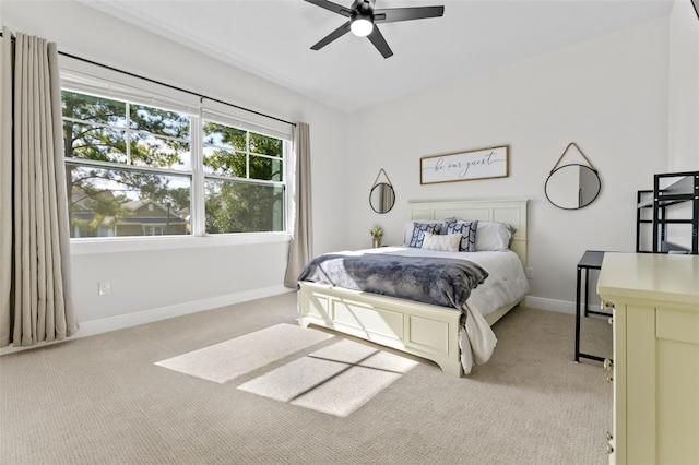 4586 Hickory Oak Dr, Brooksville, FL 34601 - bedroom with light colored carpet, baseboards, and a ceiling fan